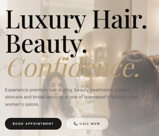 Unmodified crop of the real Infinity Salon hero showing serif typography, champagne italic emphasis and appointment and call actions.